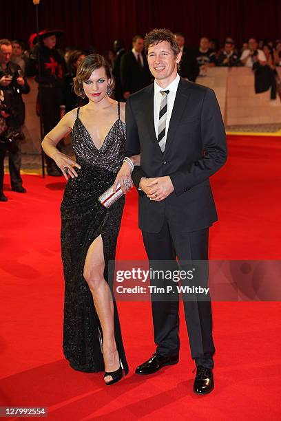 Actress Milla Jovovich and Director Paul Anderson attend the E One presents the world exclusive premiere of "The Three Musketeers" at Vue Westfield...