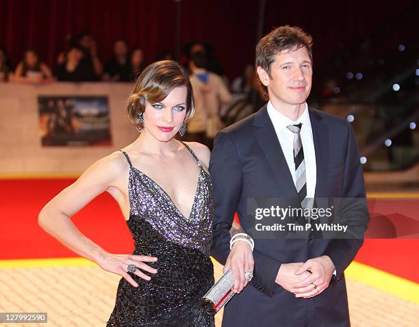 Actress Milla Jovovich and Director Paul Anderson attend the E One presents the world exclusive premiere of "The Three Musketeers" at Vue Westfield...