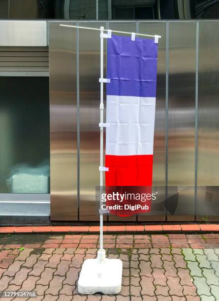 tricolor banner on the street - vertical flag stock pictures, royalty-free photos & images