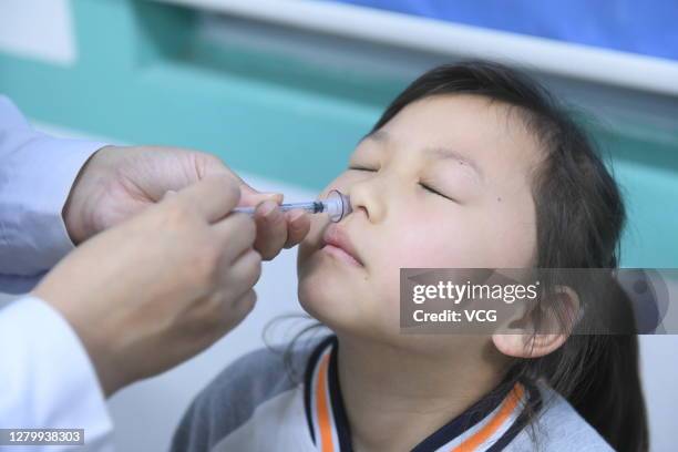 Child receives flu vaccination at a clinic on October 12, 2020 in Fuyang, Anhui Province of China.