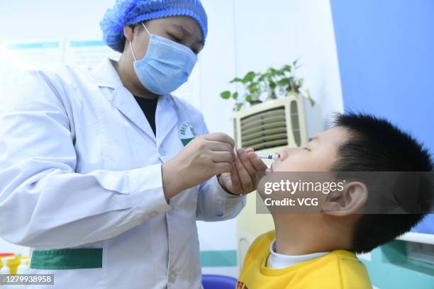 Child receives flu vaccination at a clinic on October 12, 2020 in Fuyang, Anhui Province of China.