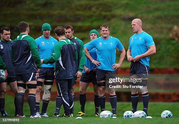 Jamie Heaslip of Ireland and teammate Paul O'Connell look on as Ireland share a team talk during an Ireland IRB Rugby World Cup 2011 training session...
