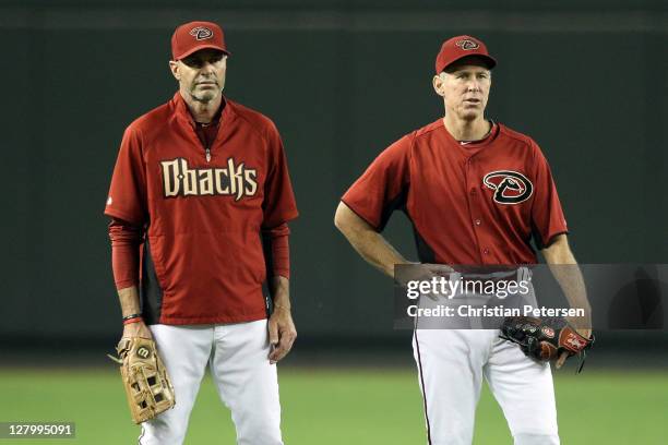 Manager Kirk Gibson of the Arizona Diamondbacks stands with bench coach Alan Trammell before Game Three of the National League Division Series...