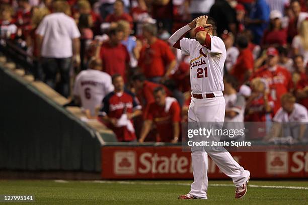 Allen Craig of the St. Louis Cardinals reacts after hitting in to a double play to end the eighth inning of Game Three of the National League...