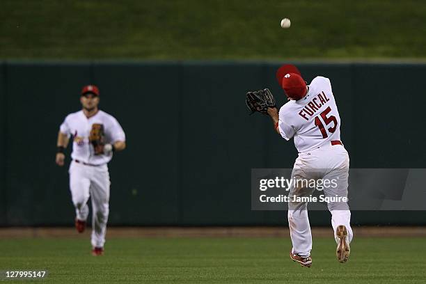 Rafael Furcal of the St. Louis Cardinals makes an over-the-shoulder catch in the ninth inning of Game Three of the National League Division Series...