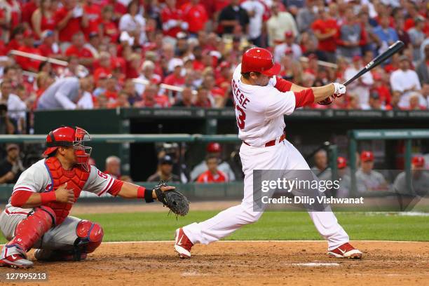 David Freese of the St. Louis Cardinals hits an RBI single against reliever Vance Worley of the Philadelphia Phillies during game three of the...