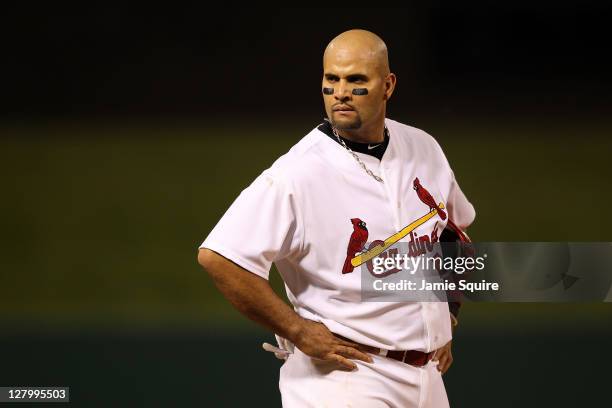 Albert Pujols of the St. Louis Cardinals looks on against the Philadelphia Phillies during Game Three of the National League Division Series at Busch...