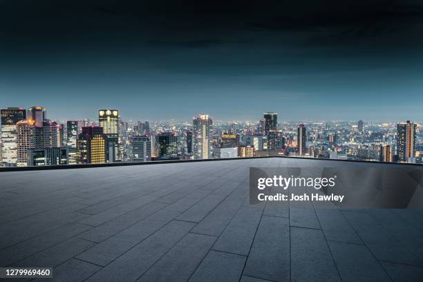 osaka skyline and parking  lot - empty lot night stock-fotos und bilder