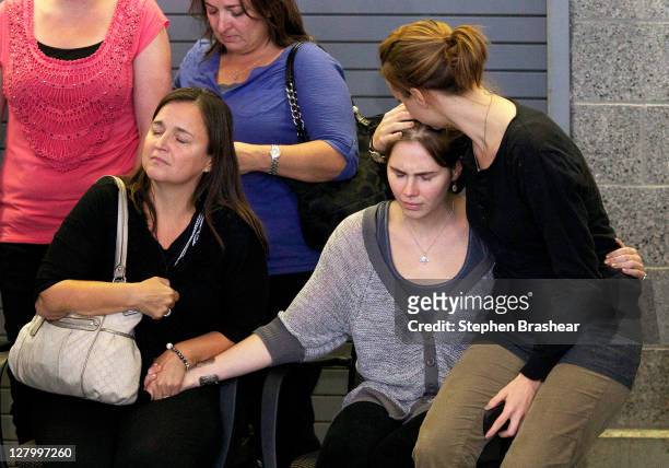 Amanda Knox , is comforted by sister Deanna Knox , and mother Edda Mellas during a press conference on October 4, 2011 in Seattle, Washington....