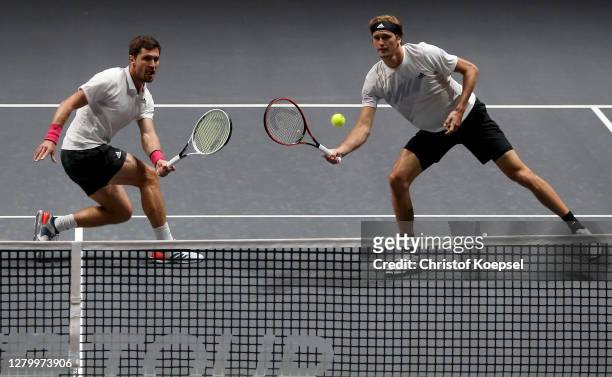 Mischa Zverev of Germany and Alexander Zverev of Germany play during the match between Raven Klassen of South Africa and Oliver Marach of Austria...