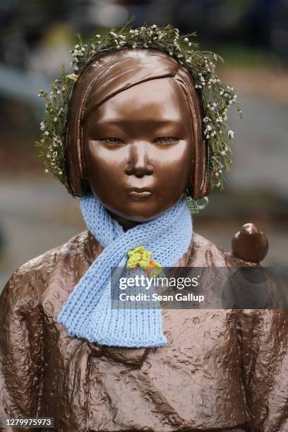 Memorial to World War II Korean "comfort women" stands at a rally by protesters in support of keeping it on October 13, 2020 in Berlin, Germany. The...