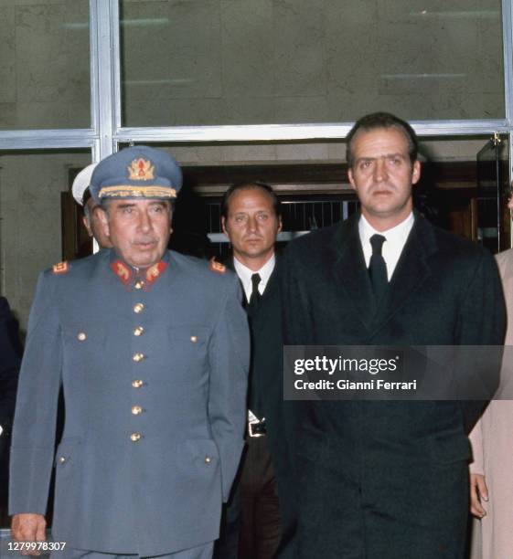 Rey Juan Carlos I and President of Chile Augusto Pinochet at funerals of Francisco Franco, Madrid, Spain, 1975. .