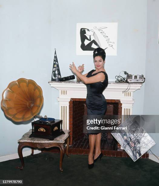 Actress and singer Lola Flores with some objects related to her horoscope, Madrid, Spain, 1963. .