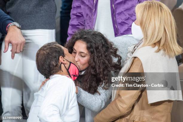 October 11. Rafael Nadal of Spain receives a congratulatory kiss from his wife Xisca Perello after his victory against Novak Djokovic of Serbia in...