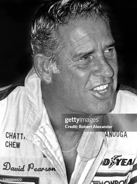 Driver David Pearson sits in the speedway garage prior to the start of the 1985 Daytona 500 stock car race at Daytona International Speedway in...