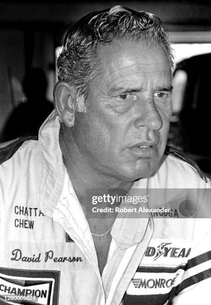 Driver David Pearson sits in the speedway garage prior to the start of the 1985 Daytona 500 stock car race at Daytona International Speedway in...