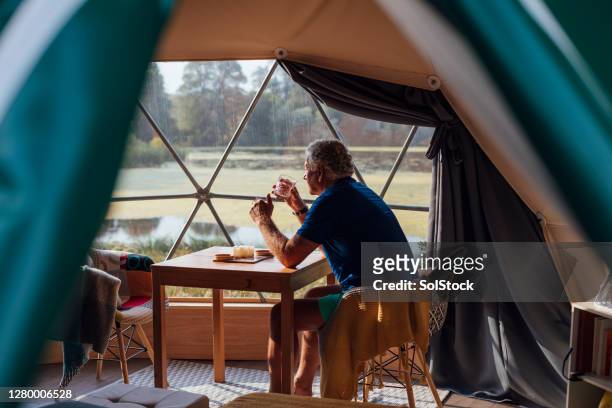 enjoying the peace and quiet - luxury tent stock pictures, royalty-free photos & images