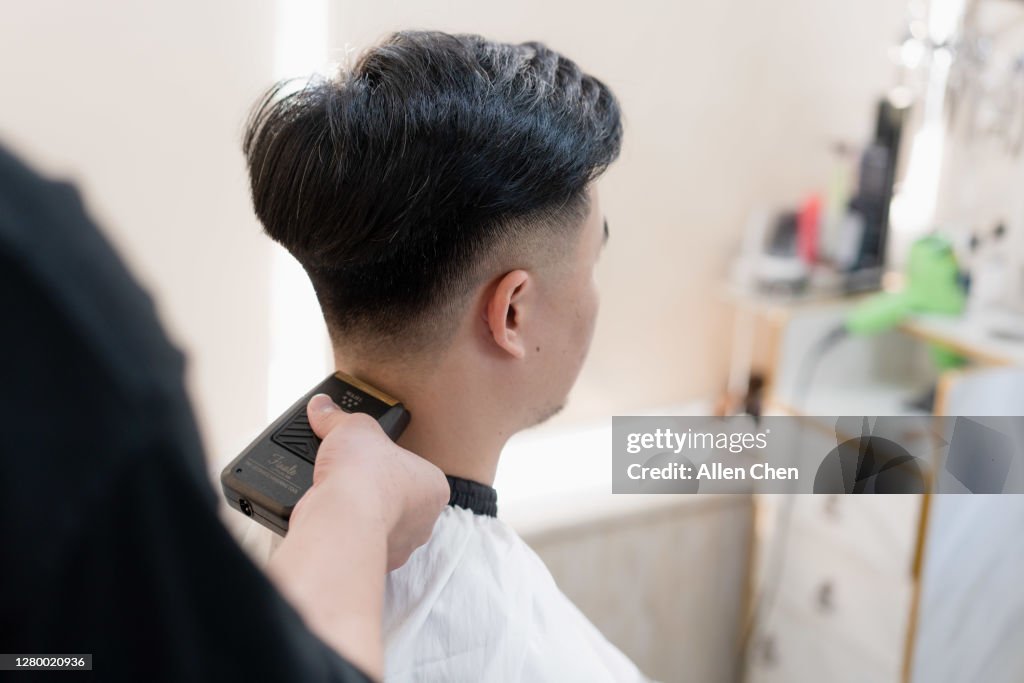 The Handsome Young Chinese Man Is Having His Hair Cut High-Res Stock Photo - Getty Images The Handsome Young Chinese Man Is Having His Hair Cut High-Res Stock Photo - Getty Images