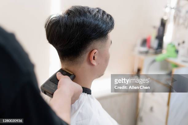 The Handsome Young Chinese Man Is Having His Hair Cut High-Res Stock Photo  - Getty Images