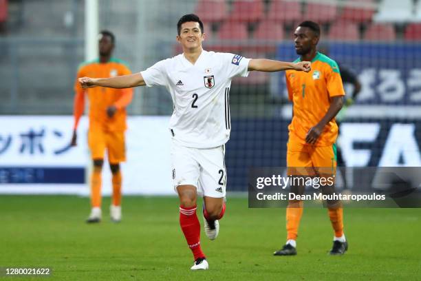 Naomichi Ueda of Japan celebrates after scoring his team's first goal during the international friendly match between Japan and Ivory Coast at...