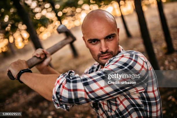 man swinging axe - axe murderer stock pictures, royalty-free photos & images