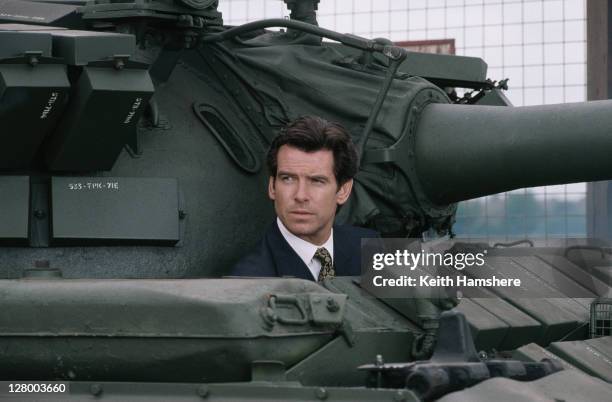 Irish actor Pierce Brosnan as 007, driving a Russian T55 Main Battle Tank, in a publicity still for the James Bond film 'GoldenEye', 1995.