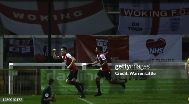 Jack Cook of Woking FC celebrates scoring the opening goal during the Vanarama National League match between Woking and Dagenham and Redbridge at...