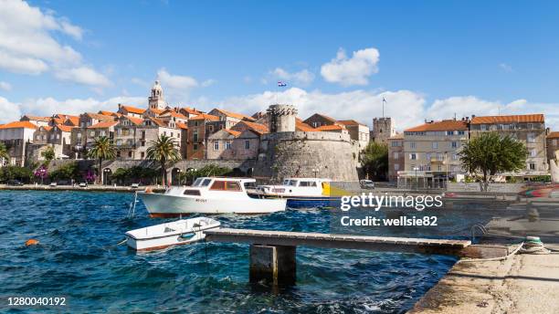 choppy waters next to korcula old town - コルチュラ島 ストックフォトと画像