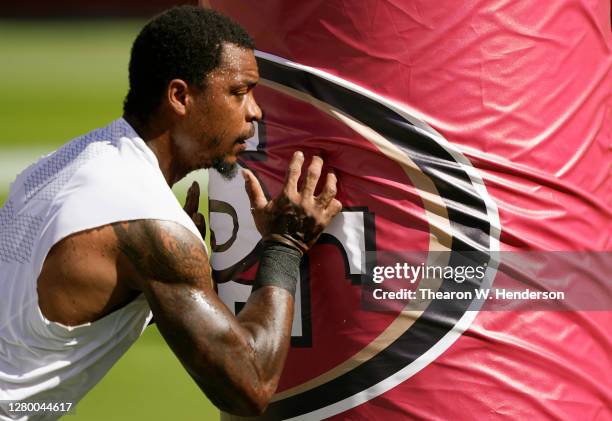 Dion Jordan of the San Francisco 49ers warms up prior to the start of an NFL football game against the Miami Dolphins at Levi's Stadium on October...