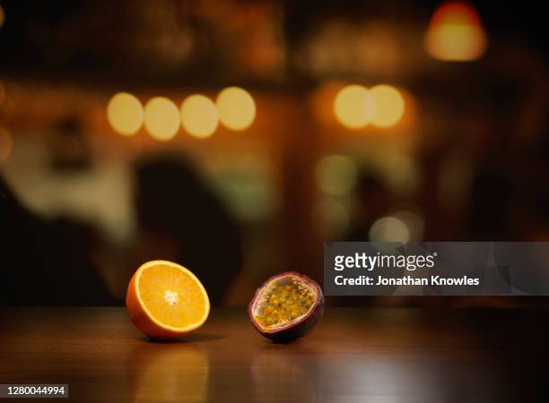 orange and passion fruit on table - focus on foreground stock pictures, royalty-free photos & images