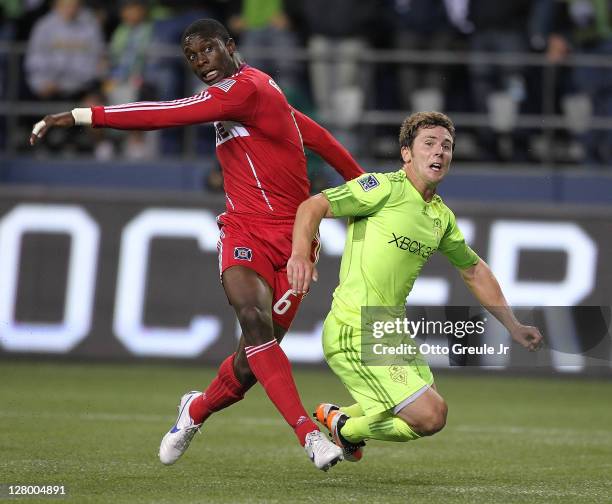 Mike Fucito of the Seattle Sounders FC battles Jalil Anibaba of the Chicago Fire during the 2011 Lamar Hunt US Open Cup Final at CenturyLink Field on...