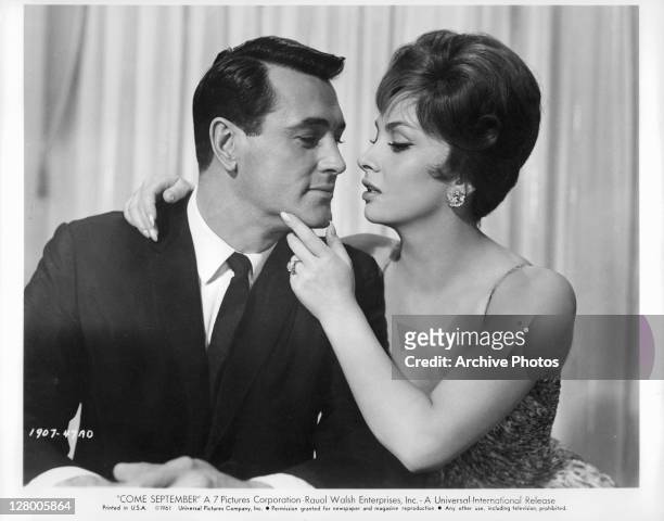 Rock Hudson and Gina Lollobrigida move in for a kiss in a scene from the film 'Come September', 1961.