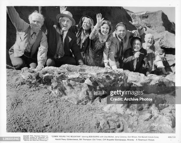 Bob Burns, Una Merkel, Jerry Colonna, Don Wilson, Pat Barrett, Harold Peary, Bill Thompson and Cliff Arquette waiving from a mountain in a scene from...