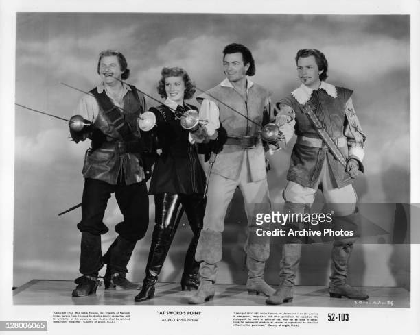 From left, Alan Hale Jr, Maureen O'Hara, Cornel Wilde, and Dan O'Herlihy in a scene from the film 'At Sword's Point', aka 'Sons of the Musketeers',...
