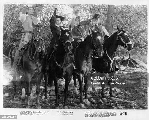 From left, Cornel Wilde, Dan O'Herlihy, and Alan Hale Jr on horseback in a scene from the film 'At Sword's Point', 1952.