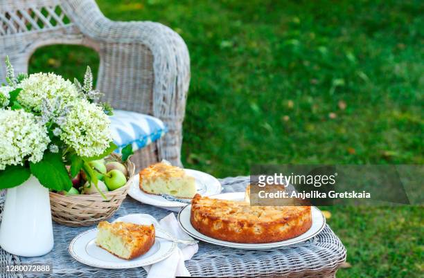 apple pie on table in the garden - apple cake stock pictures, royalty-free photos & images