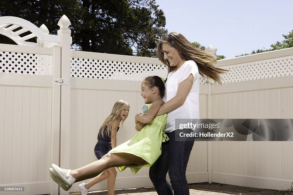 Woman spinning kids