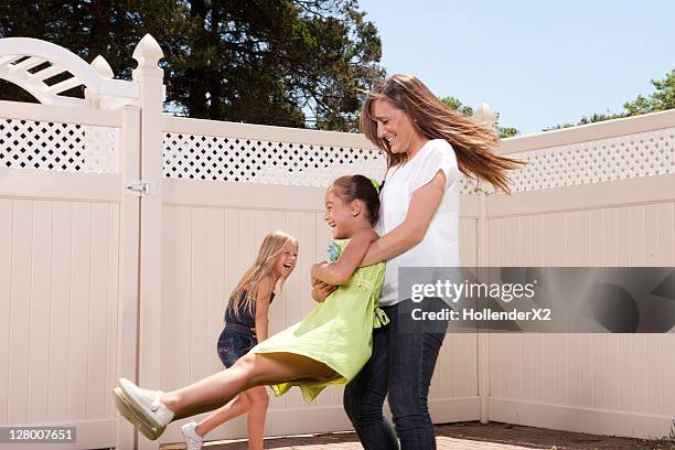 woman spinning kids - tournoyer photos et images de collection