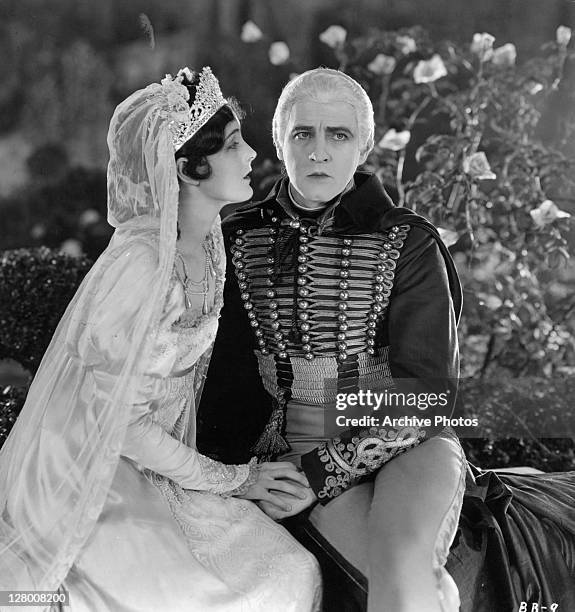 Mary Astor And John Barrymore sit in a scene from the film 'Beau Brummel', 1924.