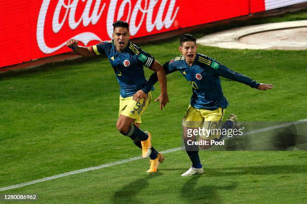 Radamel Falcao of Colombia celebrates after scoring the the second goal of his team with teammate James Rodríguez during a match between Chile and...