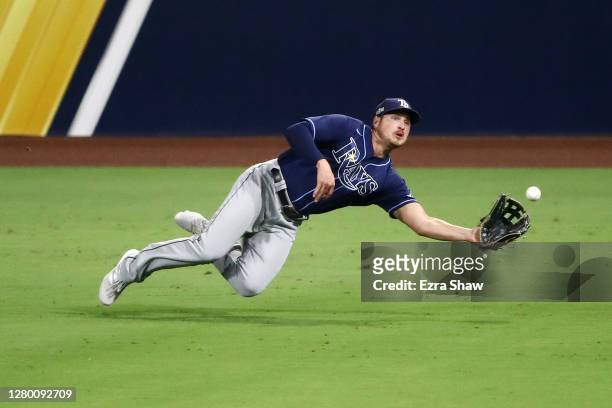 Hunter Renfroe of the Tampa Bay Rays catches a fly ball hit by George Springer of the Houston Astros during the seventh inning in Game Three of the...