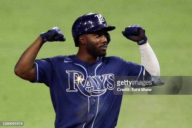 Randy Arozarena of the Tampa Bay Rays celebrates a single against the Houston Astros during the ninth inning in Game Three of the American League...
