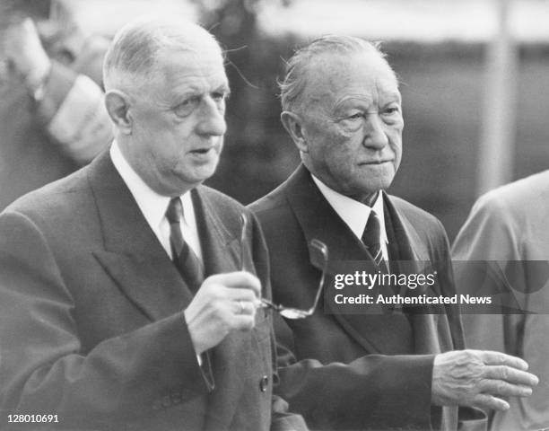 French President Charles De Gaulle is met by West-German Chancellor, Konrad Adenauer at the airport in Bonn, West-Germany, at the start of an...