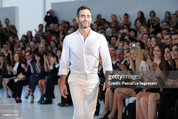 Designer Marc Jacobs acknowledges the applause of the audience after the Louis Vuitton Ready to Wear Spring / Summer 2012 show during Paris Fashion...
