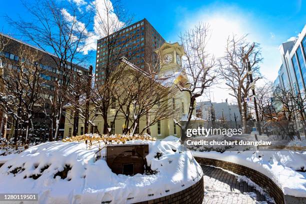 sapporo clock tower in sapporo city with winter snow - sapporo stock pictures, royalty-free photos & images