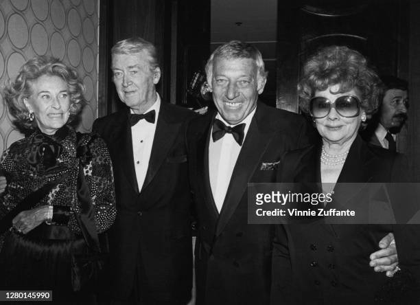 American actress and model Gloria Hatrick McLean , with her husband, American actor James Stewart , and American comedian Gary Morton with his wife,...