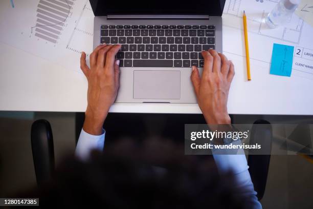 womans hands working typing on laptop in her office desk - aerial view desk stock pictures, royalty-free photos & images