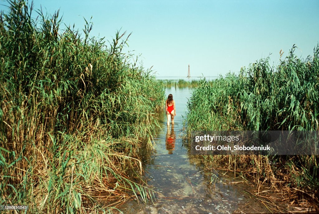 Woman swimming in river in summer