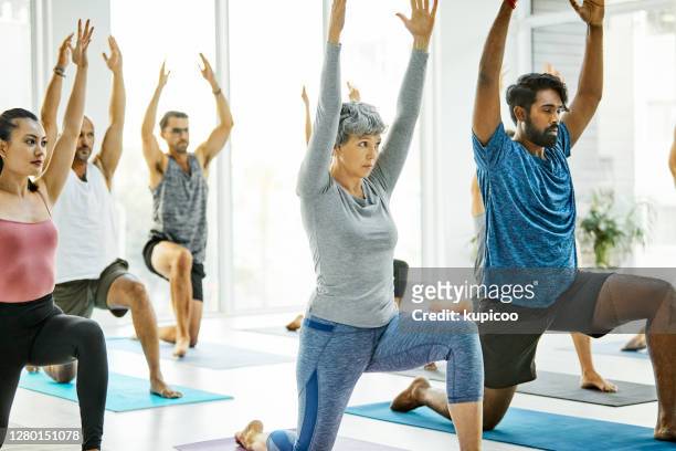yoga reveals the light within - woman normal old diverse stock pictures, royalty-free photos & images