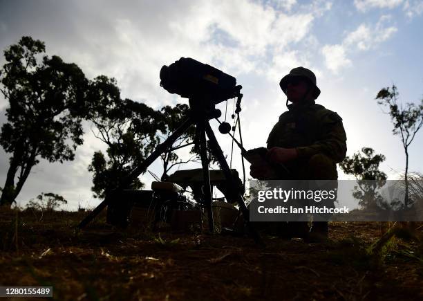 Bombardier Bailey Alder coordinates reviews his maps before he calls in an air strike from a F/A-18F Super Hornet during Exercise Nigrum Pugio on...